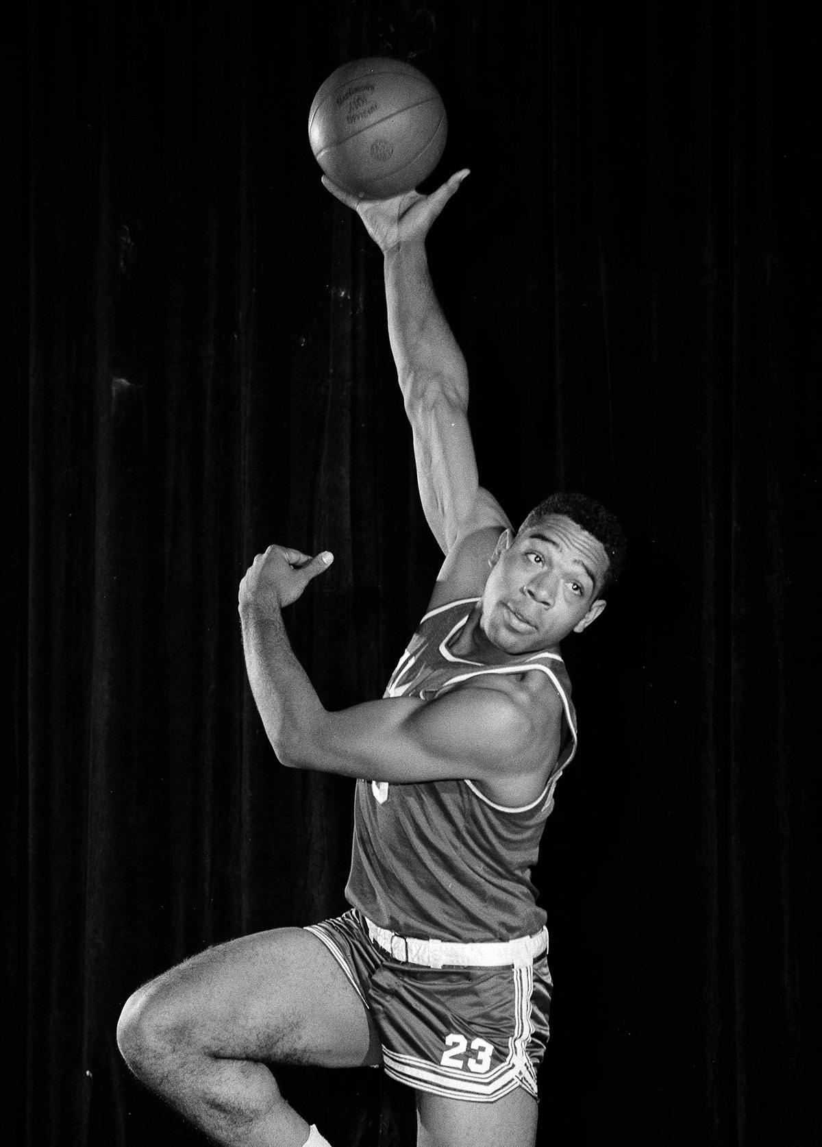 Basketball great Wayne Embry making a hook shot