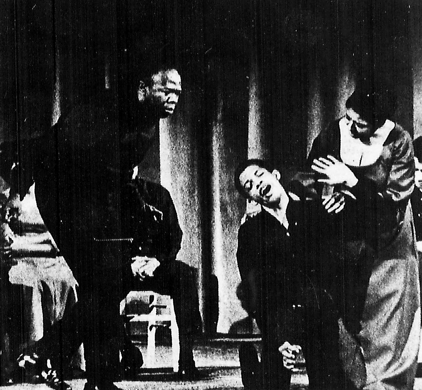 Photo of three Black actors in a stage play