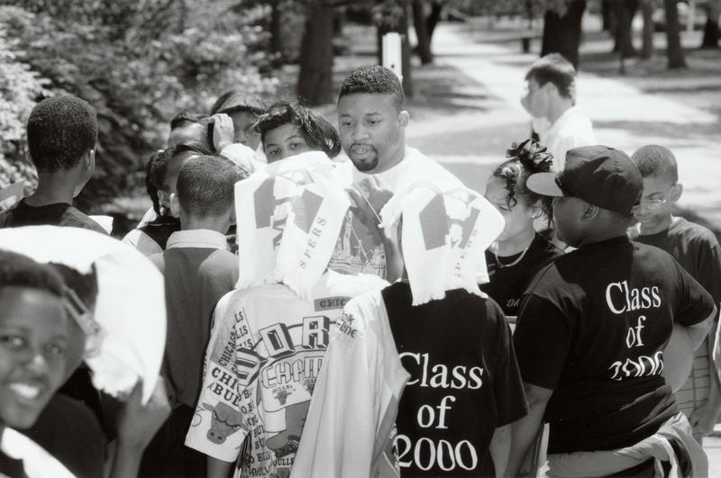 Miami University admissions counselor, Eddie Henson, talks to 6th grade Lincoln Heights students during a campus visit, 1994.